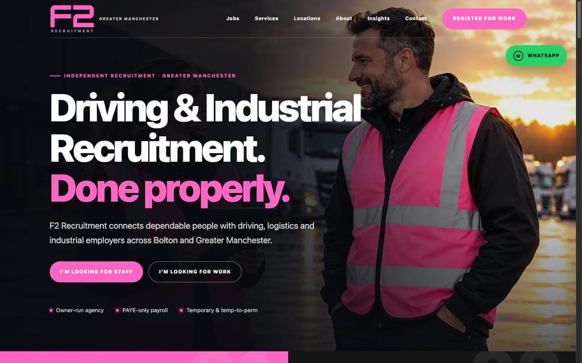 The F2 Recruitment home page on a desktop screen: a dark page with the pink F2 logo, the headline “Driving & Industrial Recruitment. Done properly.” in white and pink, two buttons, and a smiling worker in a pink hi-vis vest in front of lorries at sunset.