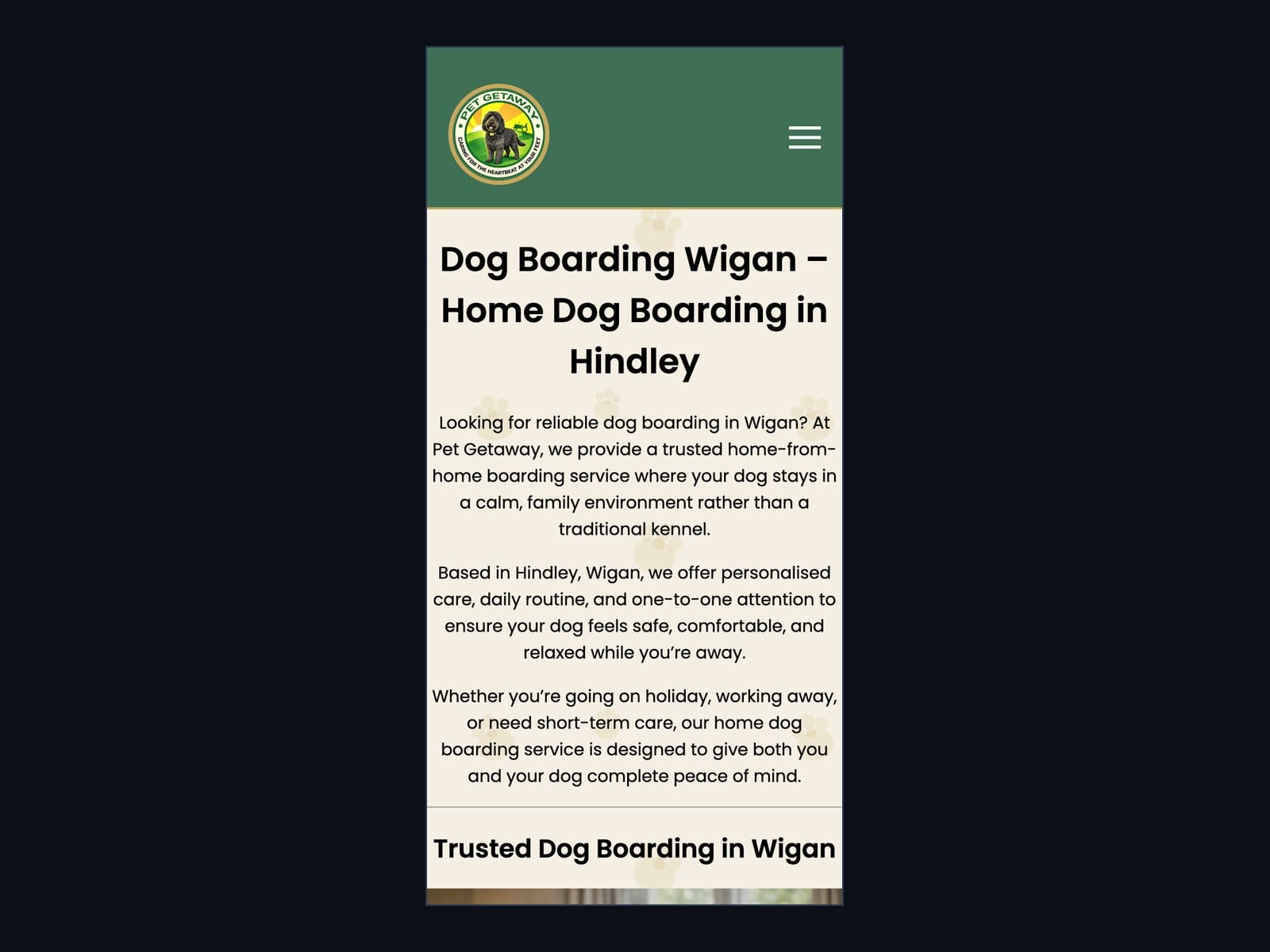The Pet Getaway website on a phone: logo and menu at the top, the headline Dog Boarding Wigan – Home Dog Boarding in Hindley and the opening paragraphs.